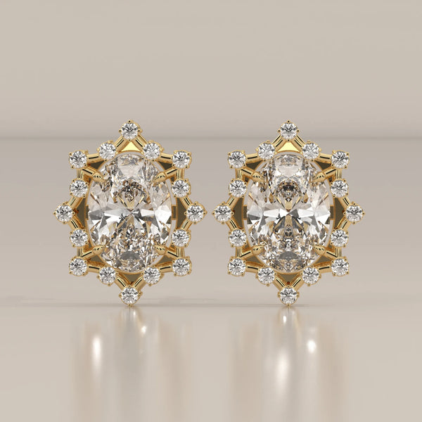 Oval Lab Grown Diamond Studs in a Snowflake Point Halo in yellow gold, shown from the front.