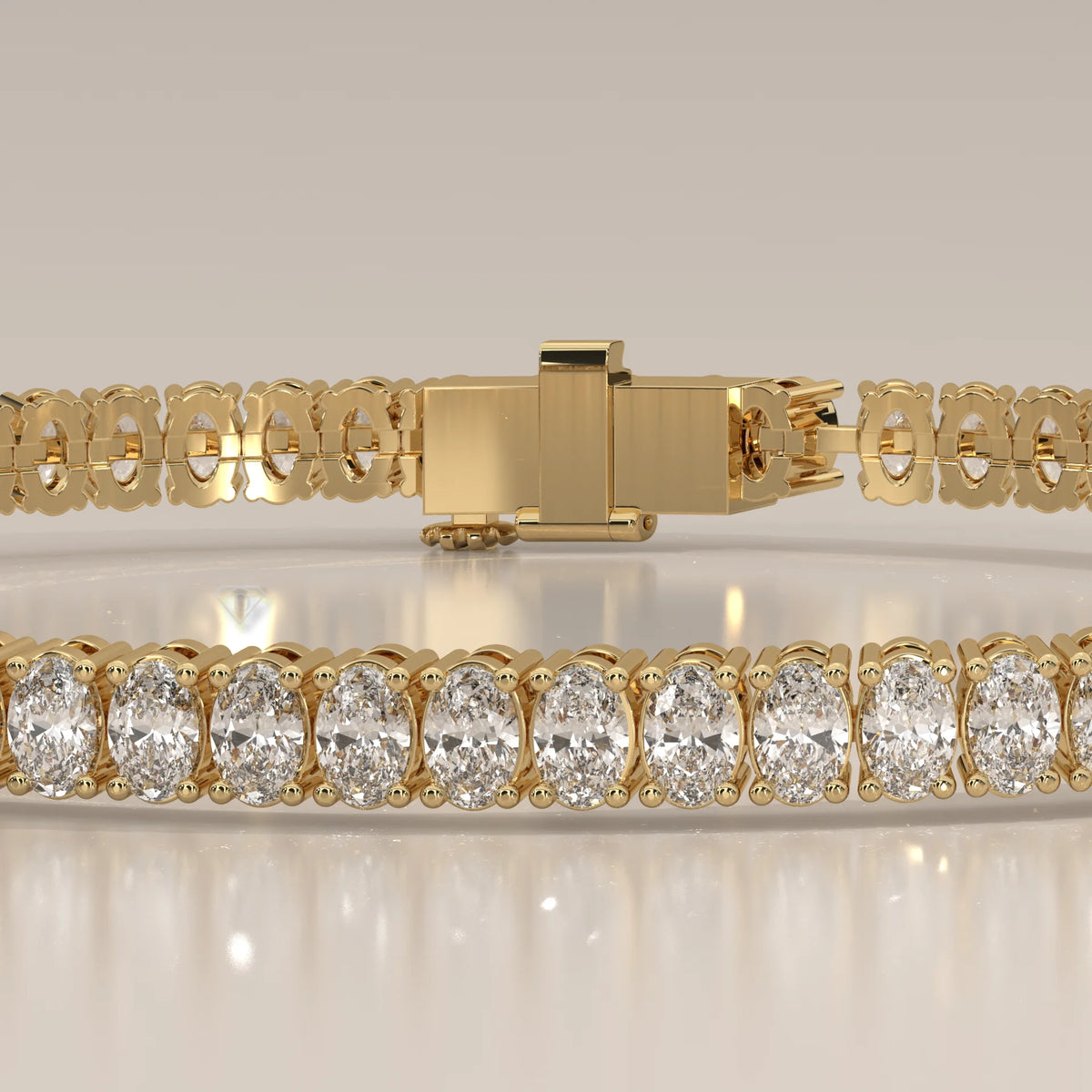 Oval Lab Grown Diamond Tennis Bracelet in Four Prong Settings in yellow gold, front view on a plain background.