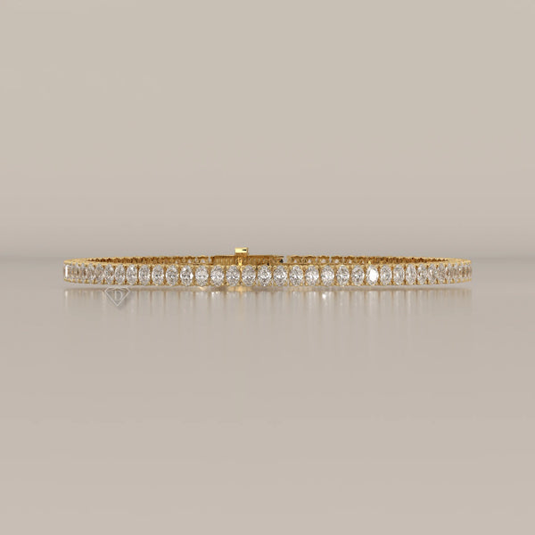Oval Lab Grown Diamond Tennis Bracelet in Four Prong Settings in yellow gold, shown from the front.