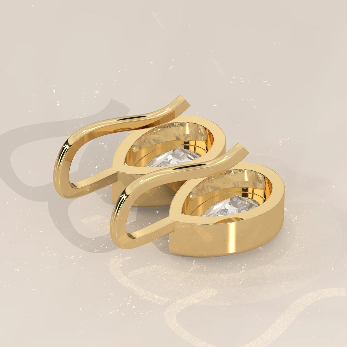 Pear Bezel Lab Grown Diamond Drop Earrings on a Solid Gold Hook in yellow gold, photographed at a three-quarter angle.