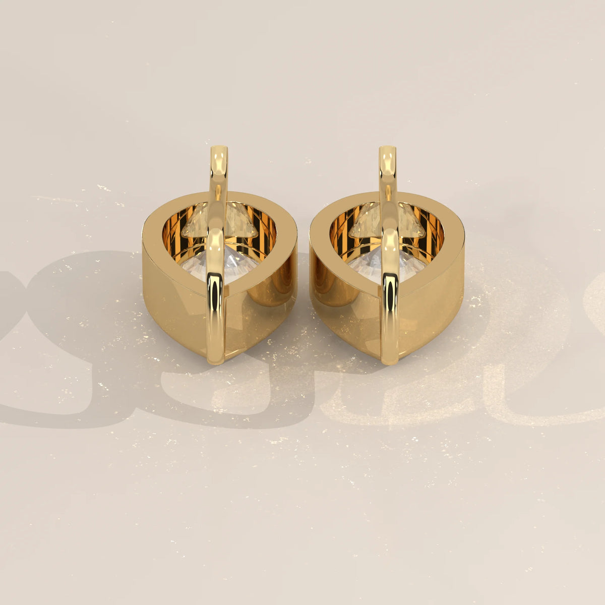 Pear Bezel Lab Grown Diamond Drop Earrings on a Solid Gold Hook in yellow gold, front view on a plain background.