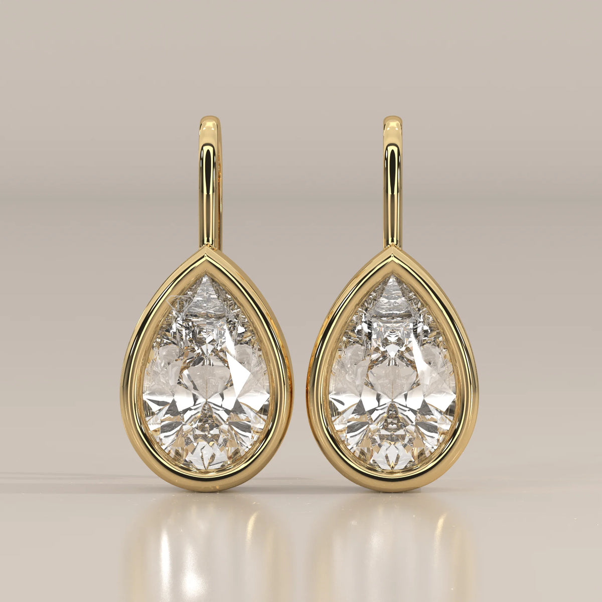 Pear Bezel Lab Grown Diamond Drop Earrings on a Solid Gold Hook in yellow gold, shown from the front.
