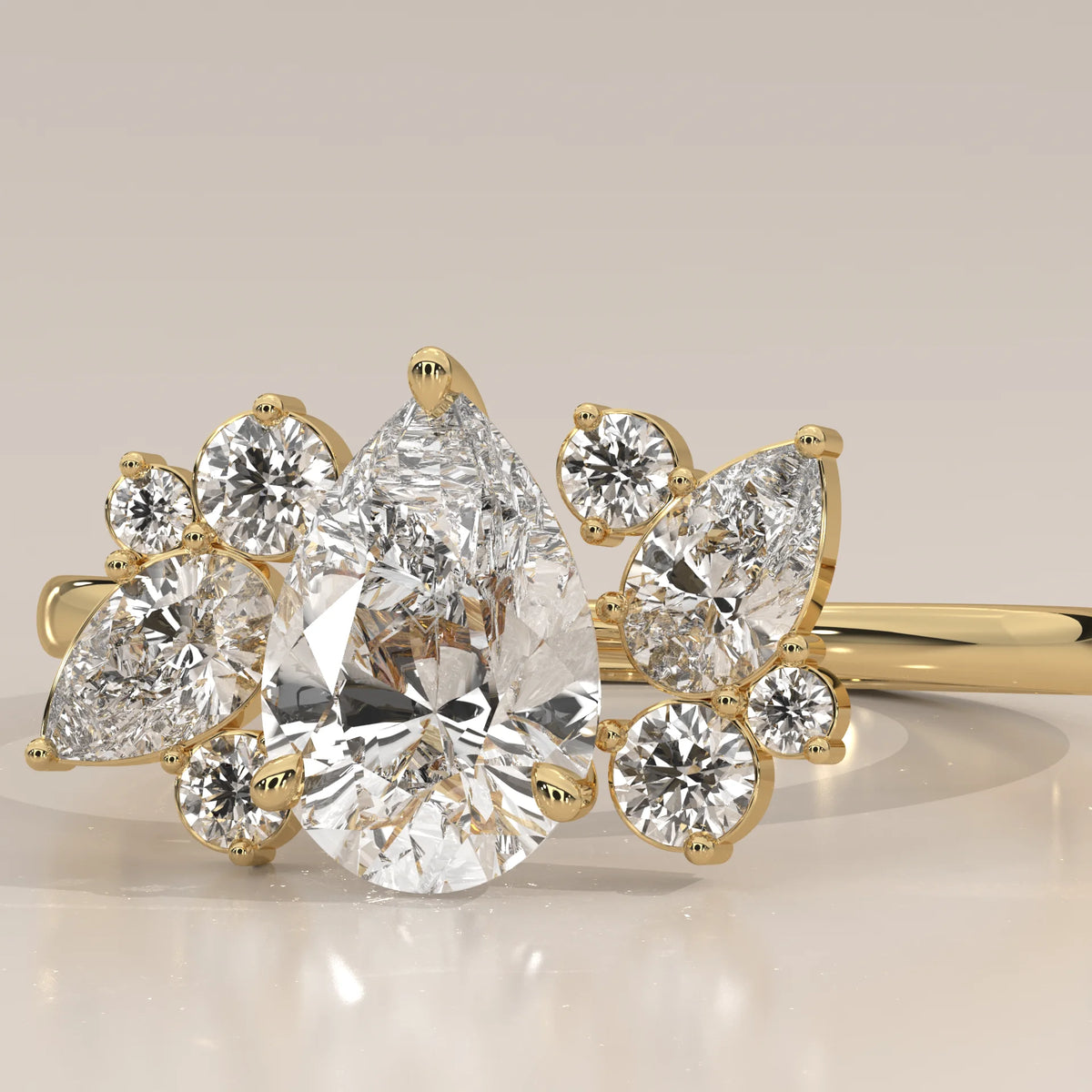 Pear Lab Grown Diamond Ring with Scattered Pear and Round Cluster in yellow gold, photographed head-on.