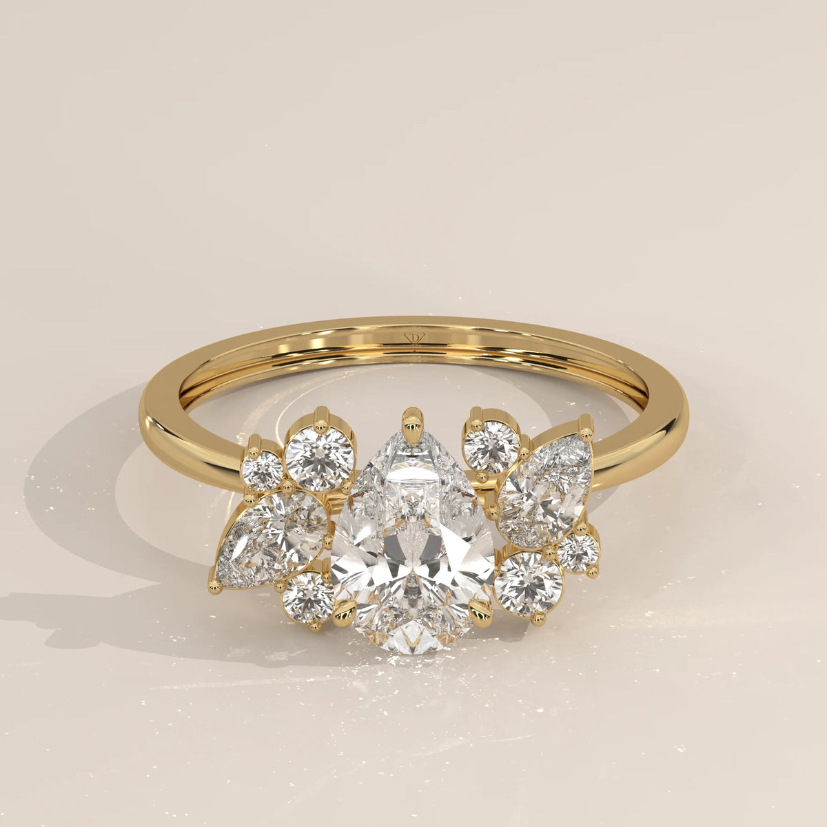 Pear Lab Grown Diamond Ring with Scattered Pear and Round Cluster in yellow gold, front view on a plain background.