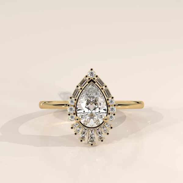Yellow gold ring with a pear-cut diamond surrounded by smaller diamonds and baguette stones.