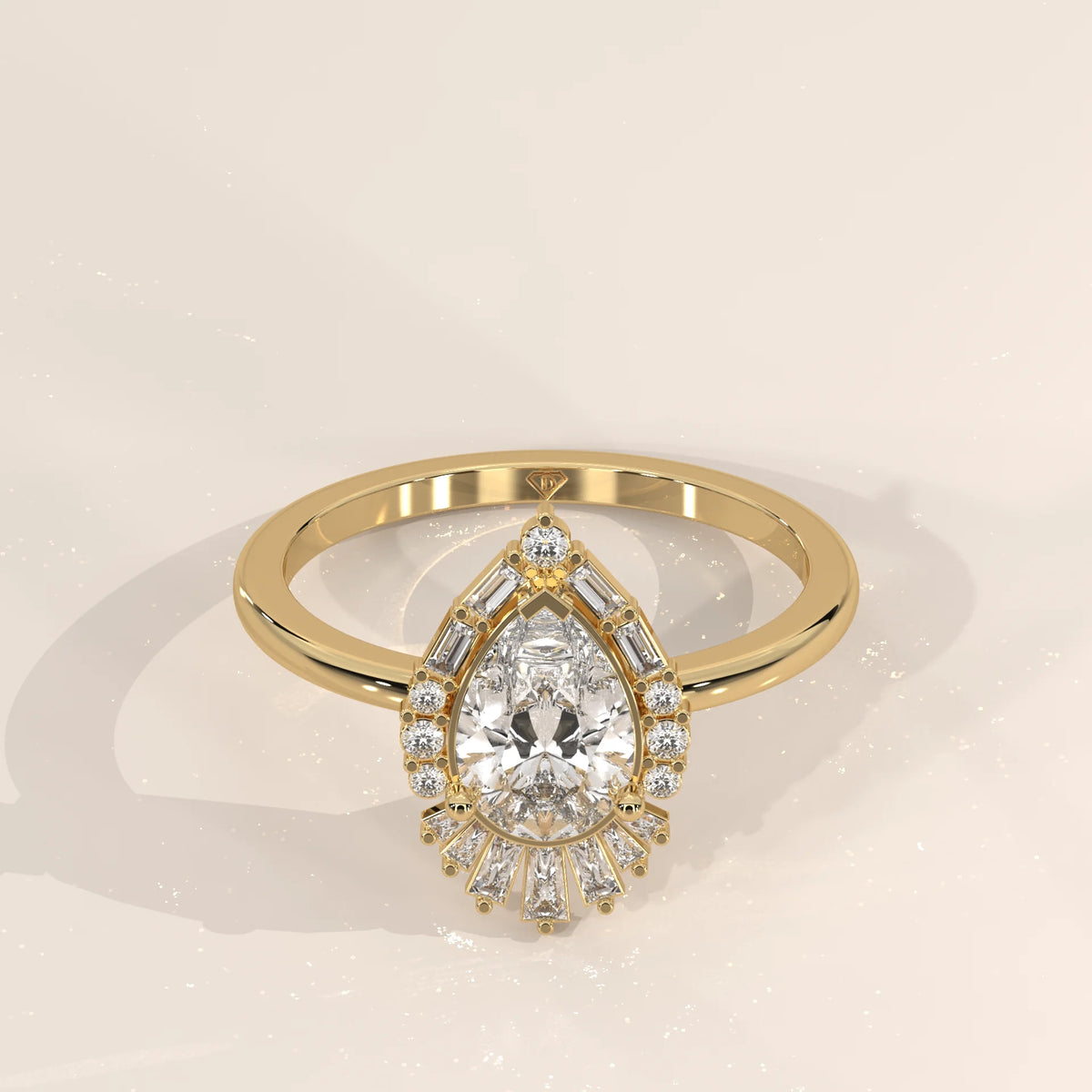 Elegant 14k yellow gold ring with a pear-cut diamond halo setting