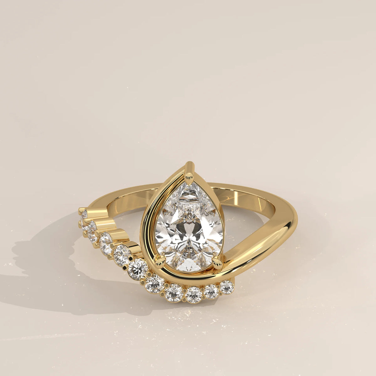 Pear Lab Grown Diamond Bypass Ring with Graduated Crescent Accents in yellow gold, shown from the front.