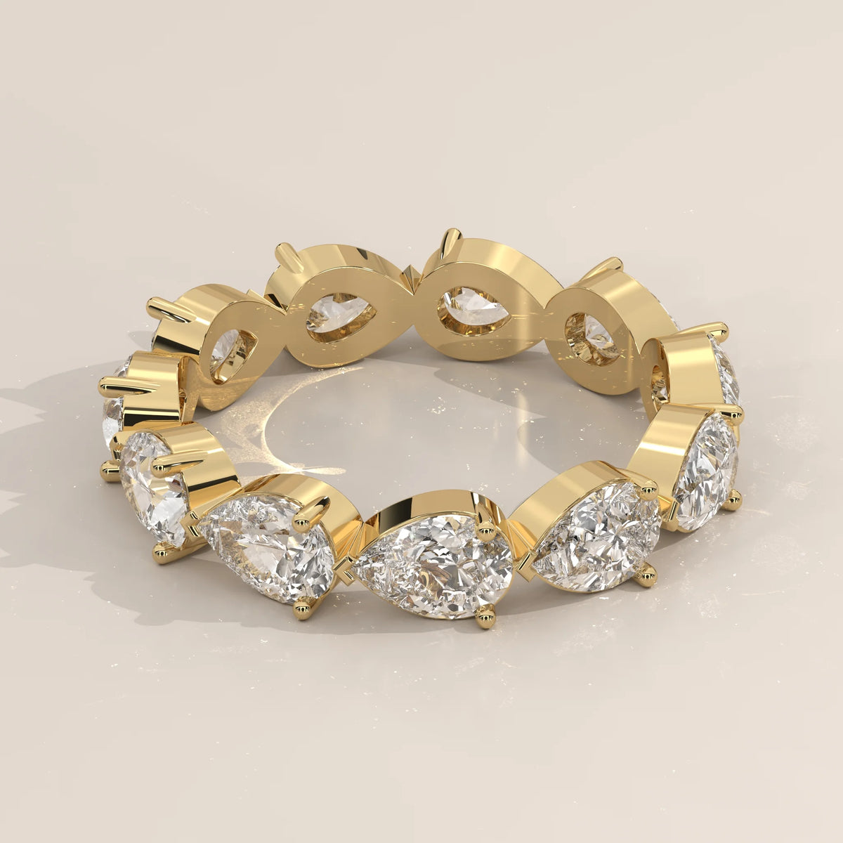 Three-Quarter View: Pear Diamond Eternity Band with Eternity Setting in Yellow Gold – Lab Grown – Driona Jewels