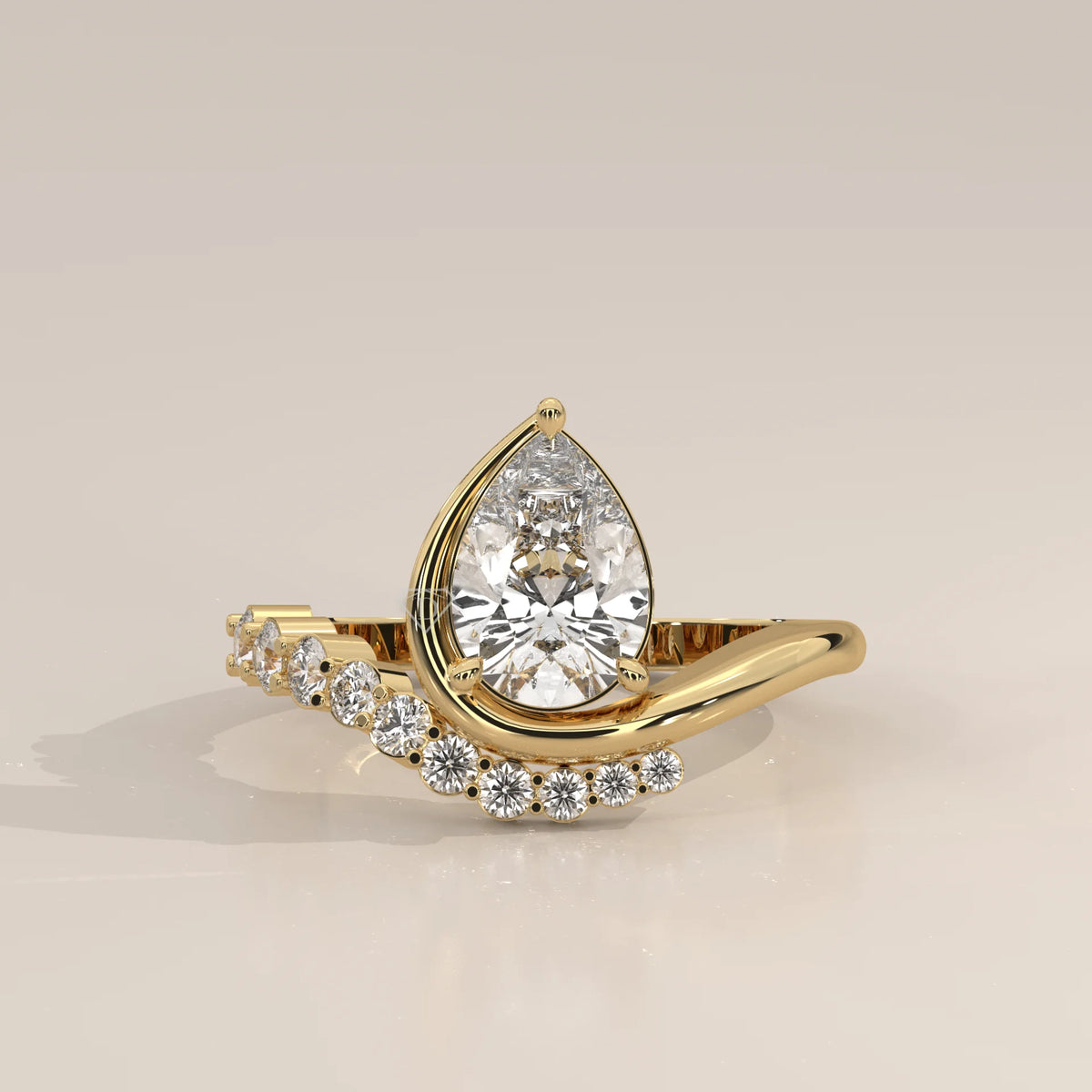 Pear Lab Grown Diamond Bypass Ring with Graduated Crescent Accents in yellow gold, photographed head-on.