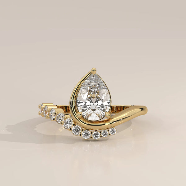 Pear Lab Grown Diamond Bypass Ring with Graduated Crescent Accents in yellow gold, photographed head-on.