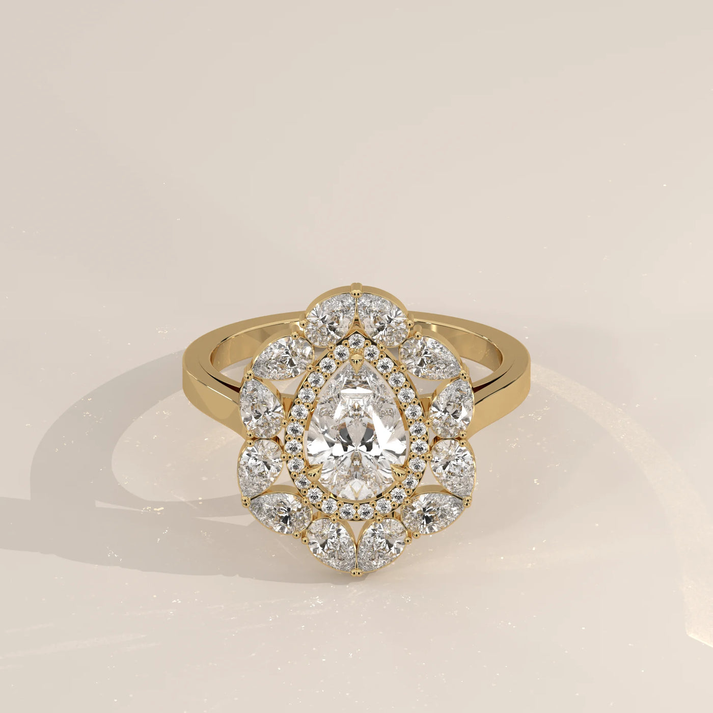 Elegant 14k gold ring with a pear-shaped diamond and intricate band design.