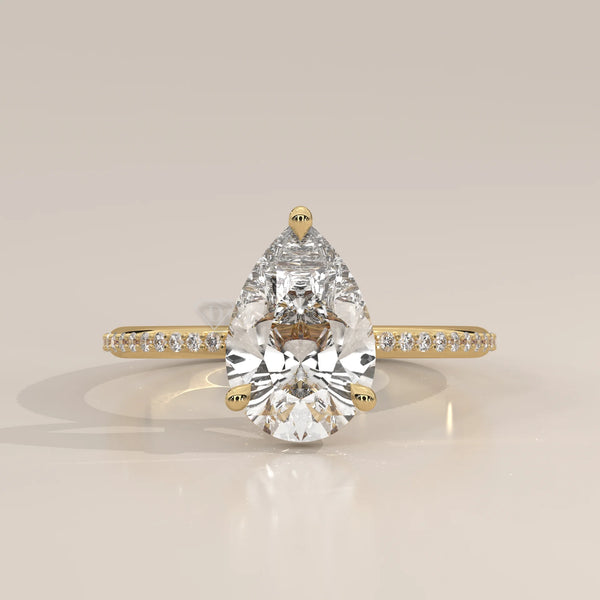 A dazzling pear-shaped diamond engagement ring set in 14k gold.