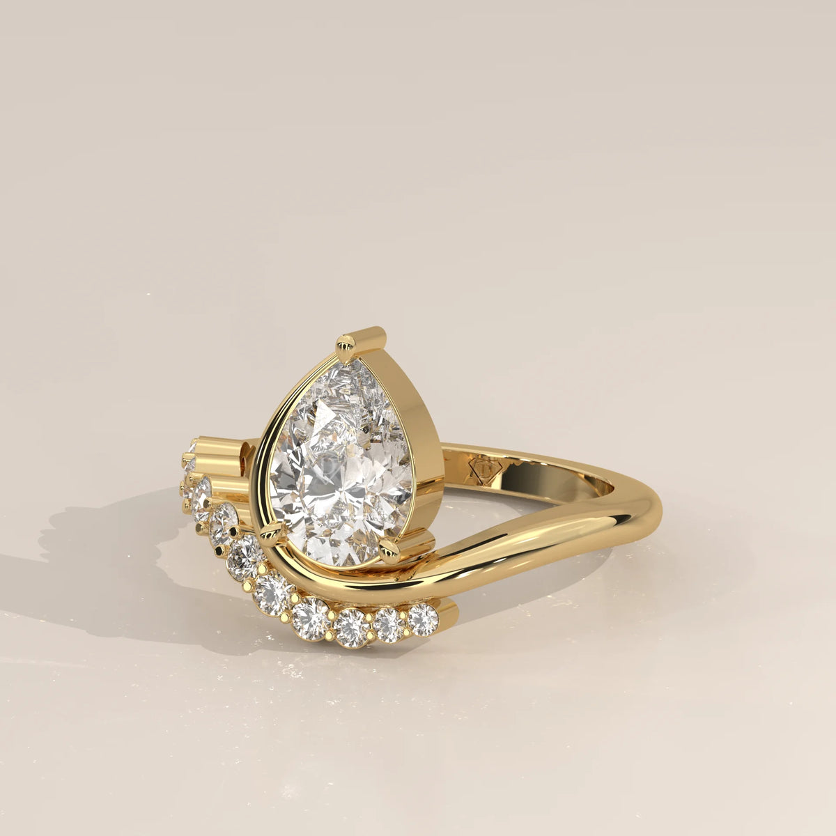 Pear Lab Grown Diamond Bypass Ring with Graduated Crescent Accents in yellow gold, shown from the side.