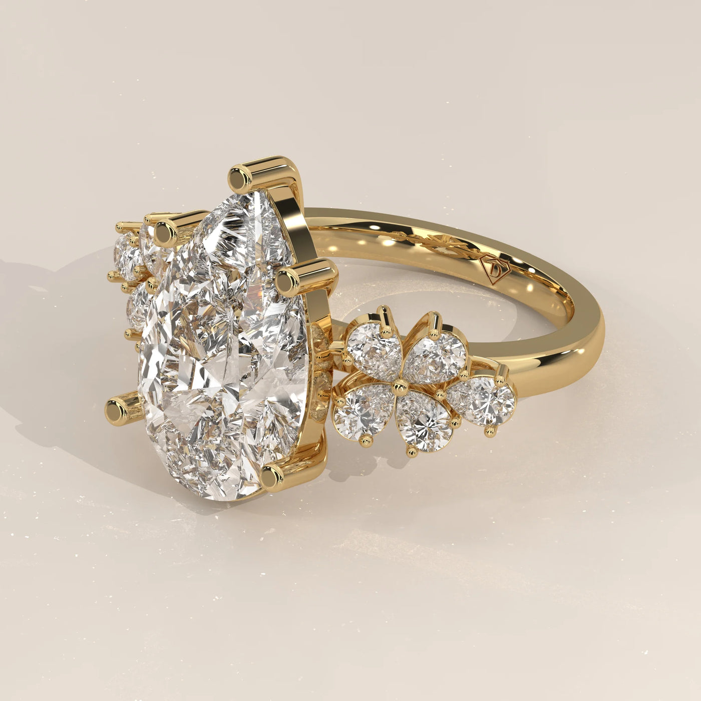 Angle View: Pear Diamond Engagement Ring with Cluster Setting in Yellow Gold – Lab Grown – Driona Jewels