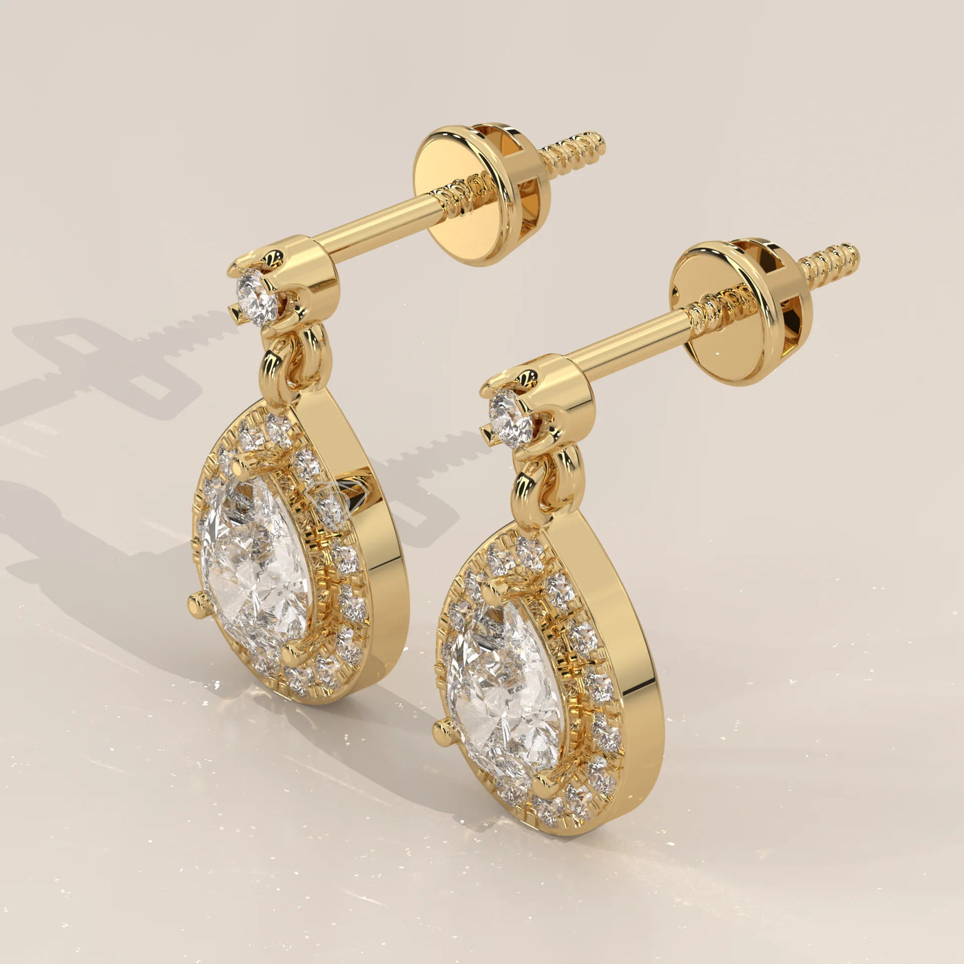 Three-Quarter View: Pear Diamond Drop Earrings with Halo Setting in Yellow Gold – Lab Grown – Driona Jewels
