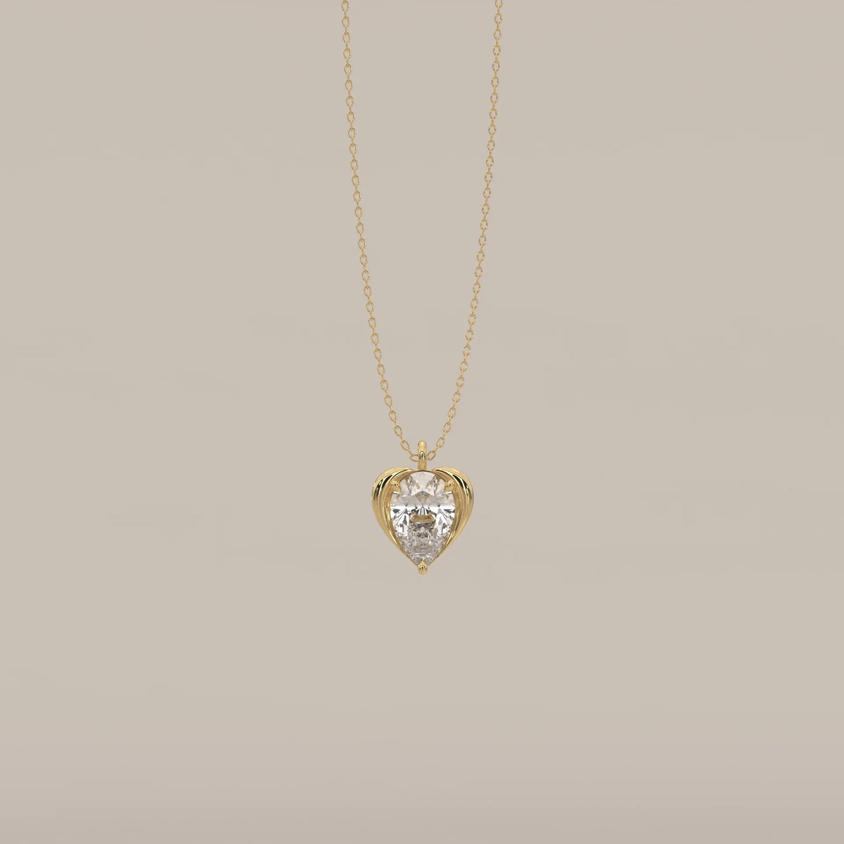 Pear Lab Grown Diamond Pendant Cradled in a Sculpted Heart Frame in yellow gold, shown from the front.