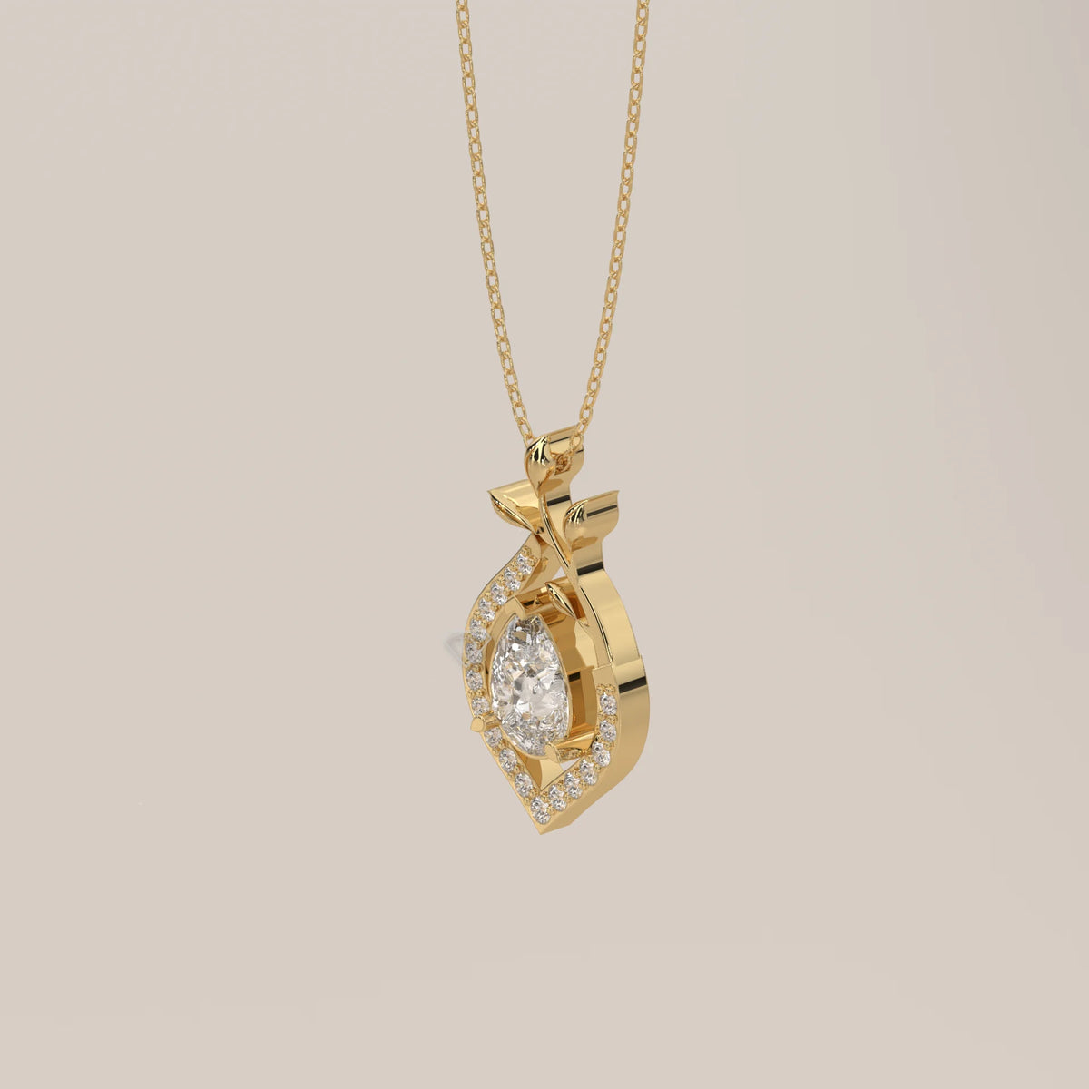 Pear Lab Grown Diamond Pendant in a Pave Teardrop with Leaf Vine in yellow gold, shown at an angle.