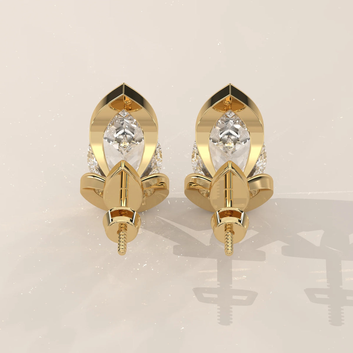 Pear Lab Grown Diamond Studs in a Curving Open Bezel in yellow gold, front view on a plain background.