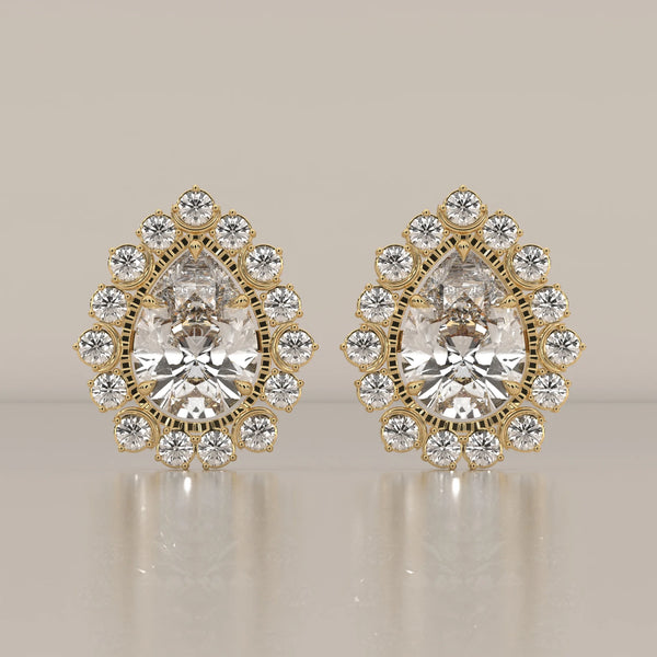Pear Lab Grown Diamond Studs in a Raised Cup Halo with Milgrain in yellow gold, shown from the front.