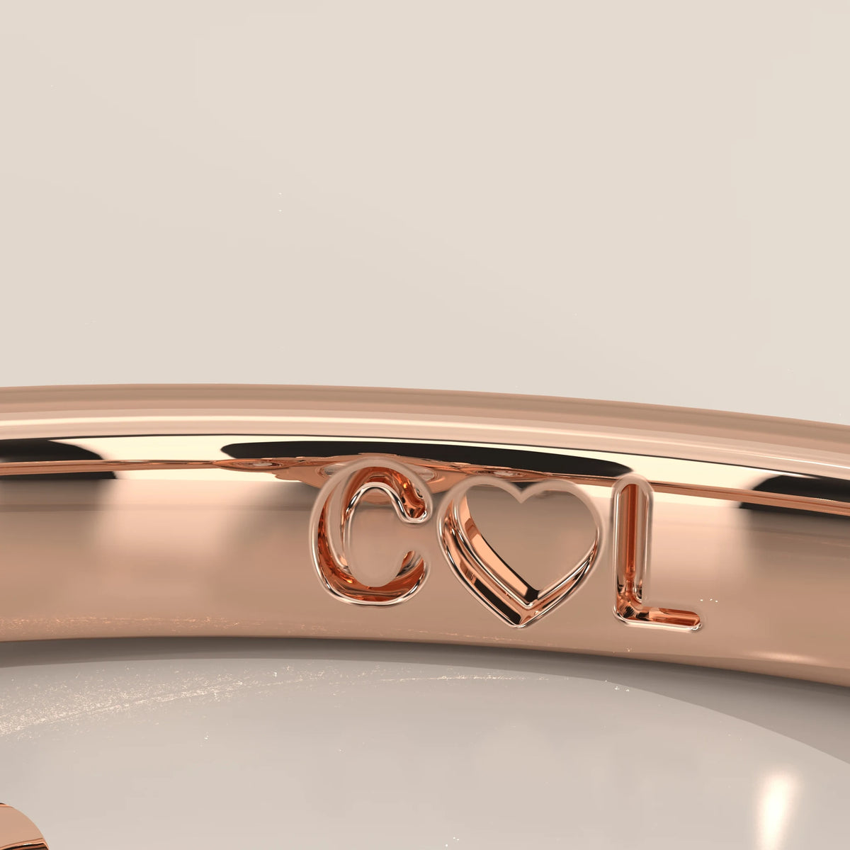 Inside band of 14k rose gold ring showing sample custom engraving
