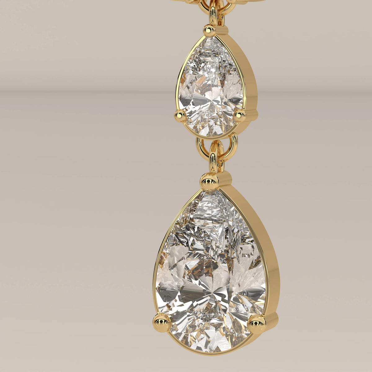 Pear and Marquise Lab Grown Diamond Fan Cluster Chandelier Earrings in yellow gold, studio photograph on a plain background.