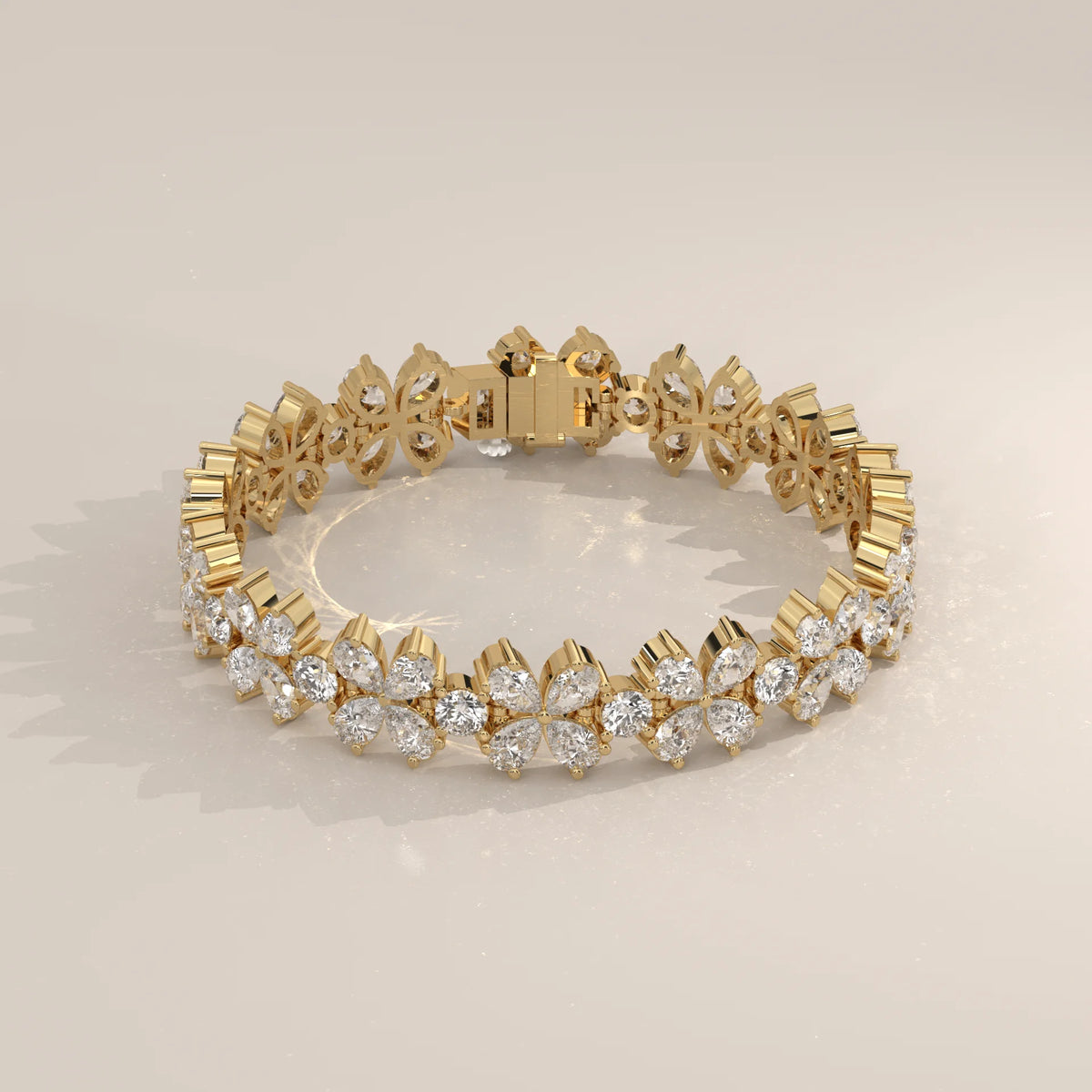 Pear Petal Flower Lab Grown Diamond Bracelet with Round Centres in yellow gold, shown at an angle.