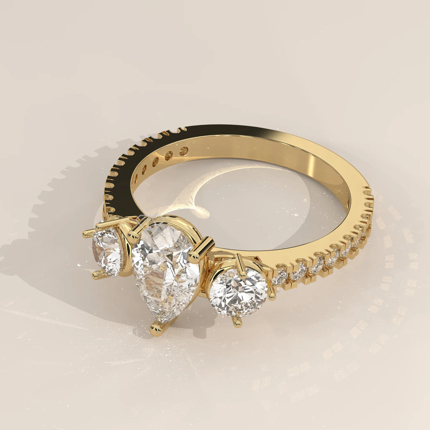 Angle View: Pear Diamond Ring with Three-Stone Setting in Yellow Gold – Lab Grown – Driona Jewels