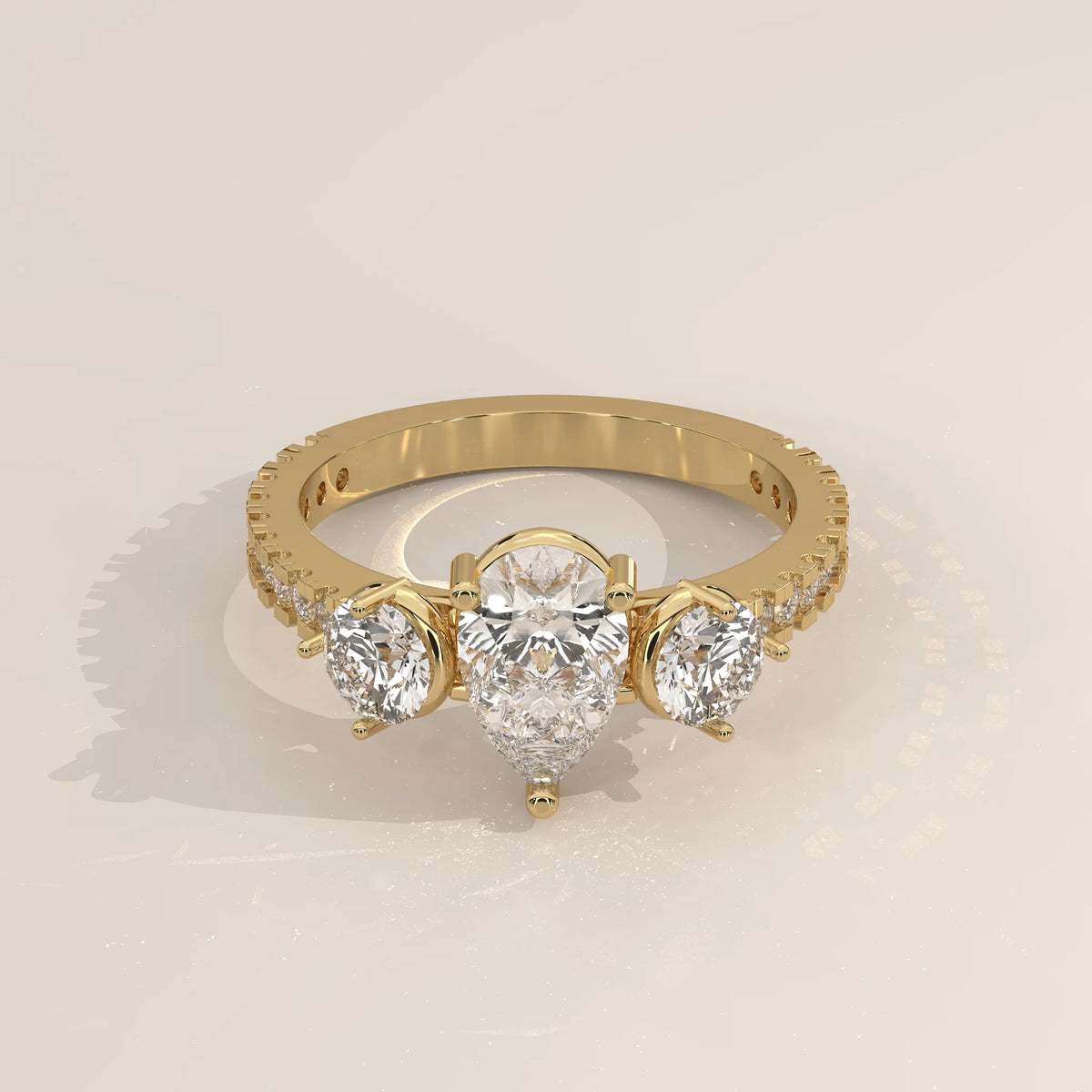 Three-Quarter View: Pear Diamond Ring with Three-Stone Setting in Yellow Gold – Lab Grown – Driona Jewels
