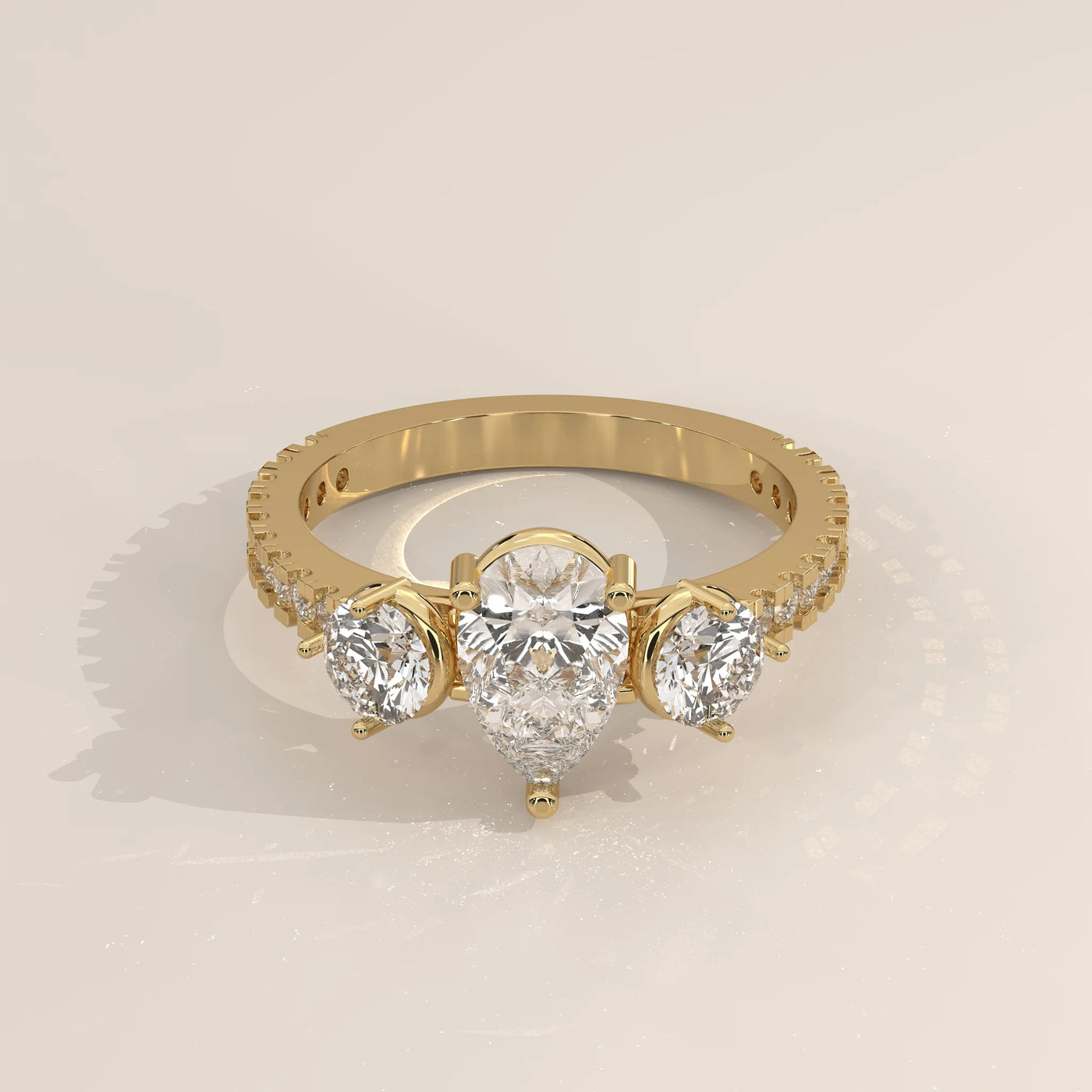 Three-Quarter View: Pear Diamond Ring with Three-Stone Setting in Yellow Gold – Lab Grown – Driona Jewels