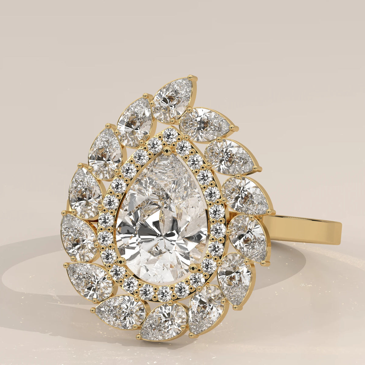 Pear Lab Grown Diamond Double Halo Ring with Pear Petal Outer Frame in yellow gold, shown at an angle.
