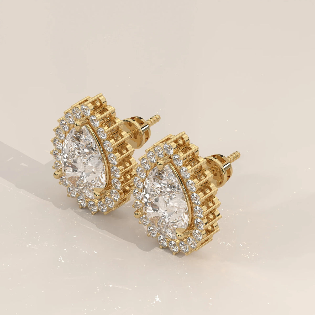 Pear Shape Halo Lab Grown Diamond Stud Earrings with Screw Backs in yellow gold, shown from the side.