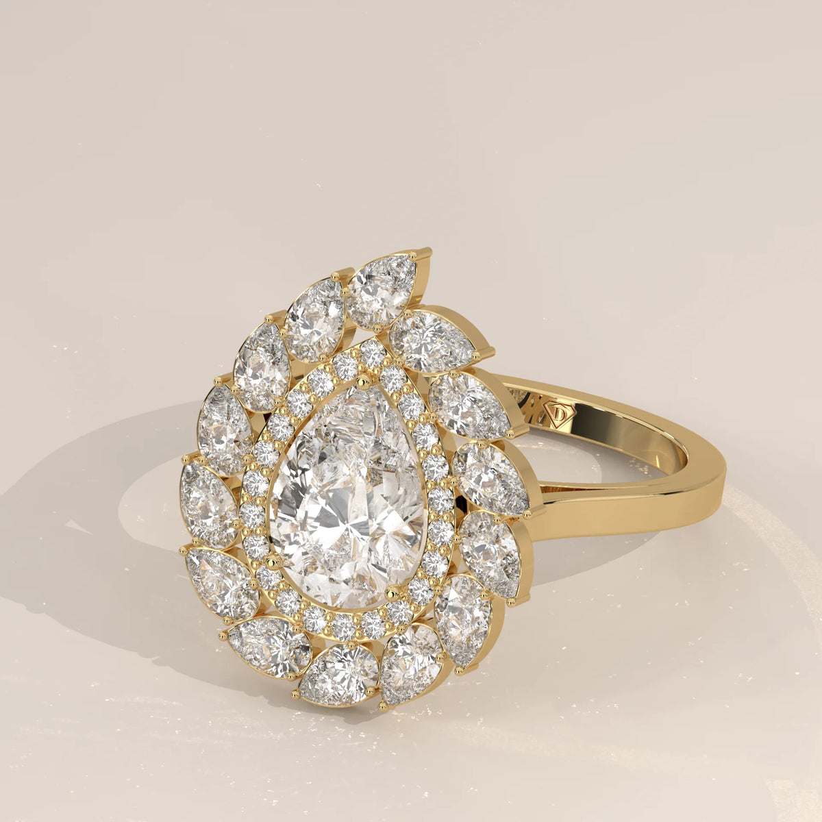 Pear Lab Grown Diamond Double Halo Ring with Pear Petal Outer Frame in yellow gold, shown from the side.