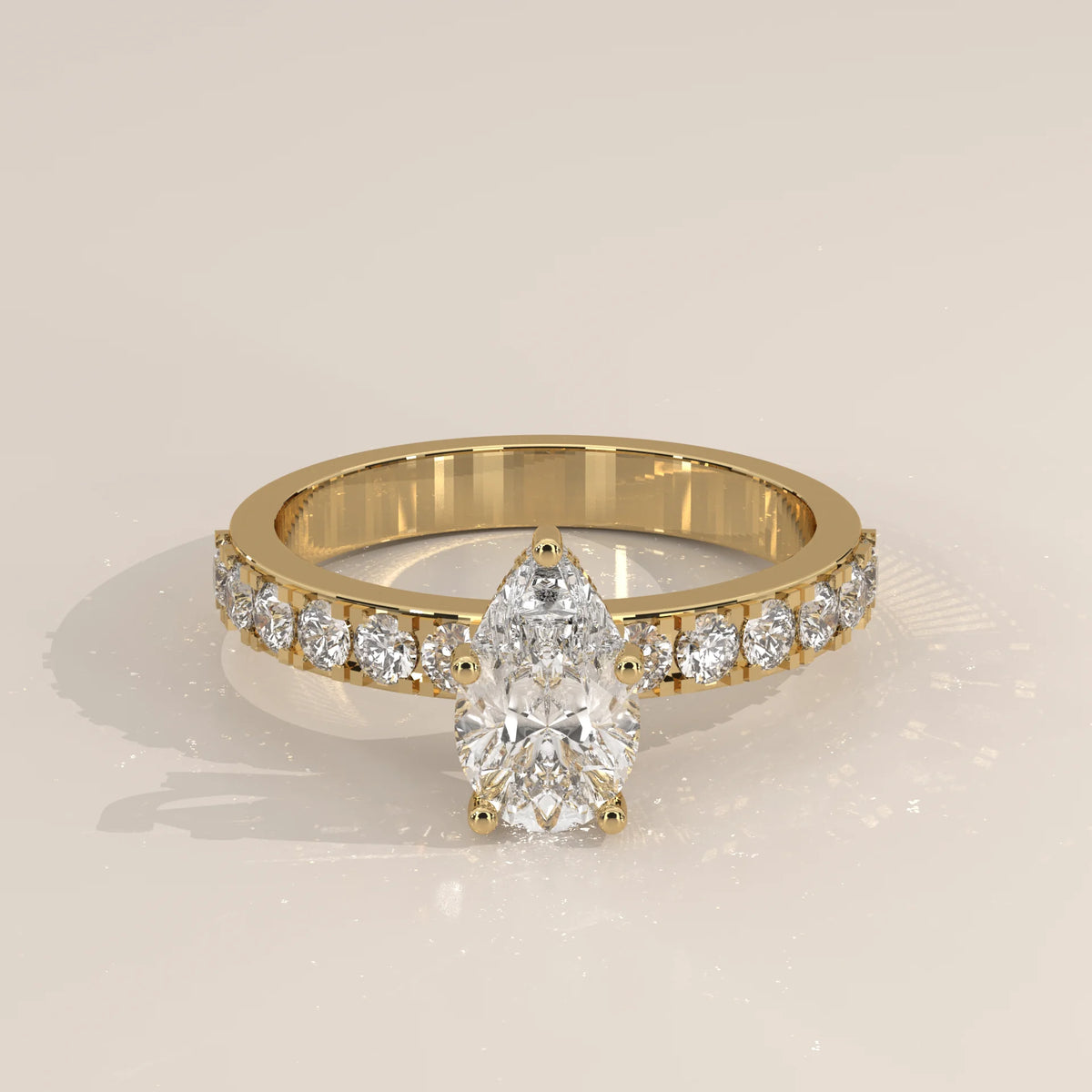 Pear Lab Grown Diamond Solitaire on a Wide Bold Pave Band in yellow gold, shown at an angle.
