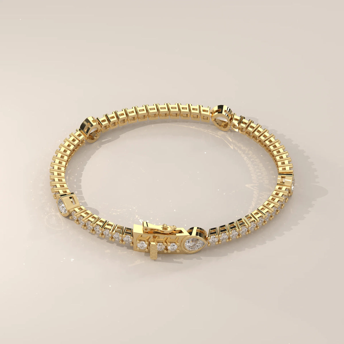 Pear Station Lab Grown Diamond Tennis Bracelet with Round Line in yellow gold, photographed head-on.