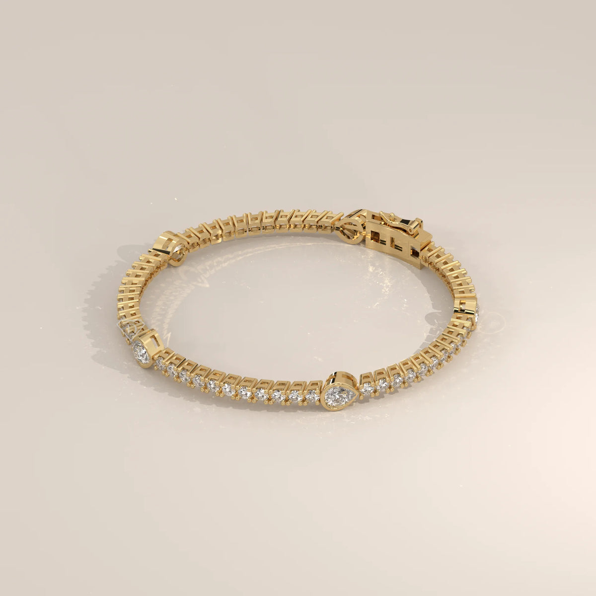 Pear Station Lab Grown Diamond Tennis Bracelet with Round Line in yellow gold, shown from the front.
