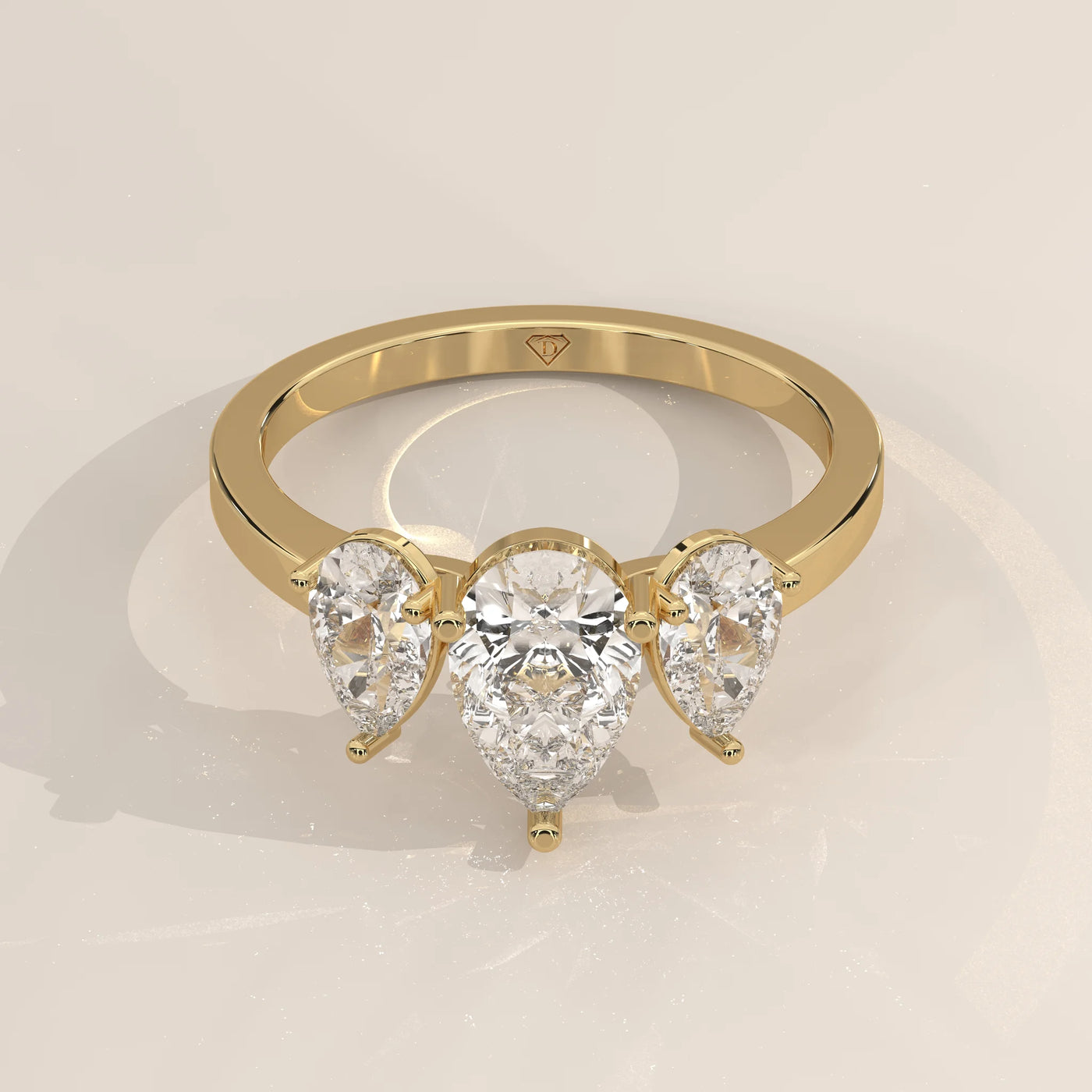 Three-Quarter View: Pear Diamond Ring with Three-Stone Setting in Yellow Gold – Lab Grown – Driona Jewels