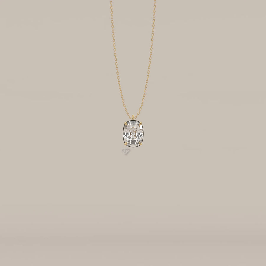 Gold necklace with a large cushion-cut diamond pendant