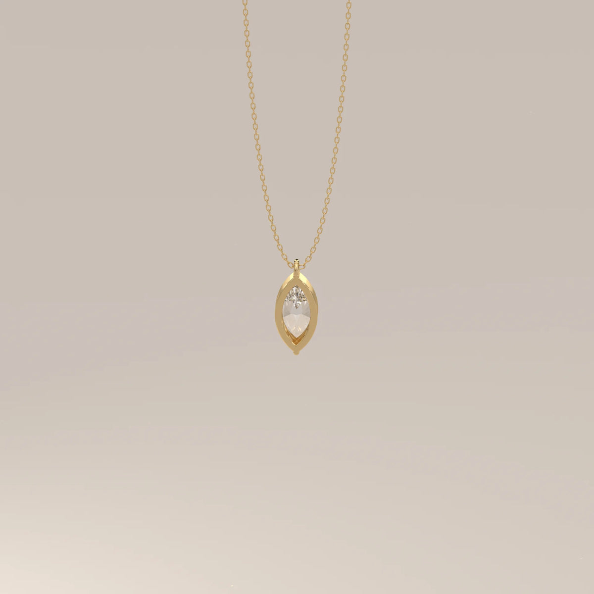 A delicate gold necklace with a marquise-shaped pendant featuring a diamond.