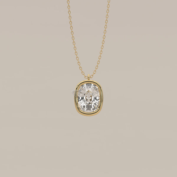 Gold necklace with a large, cushion-cut diamond pendant.