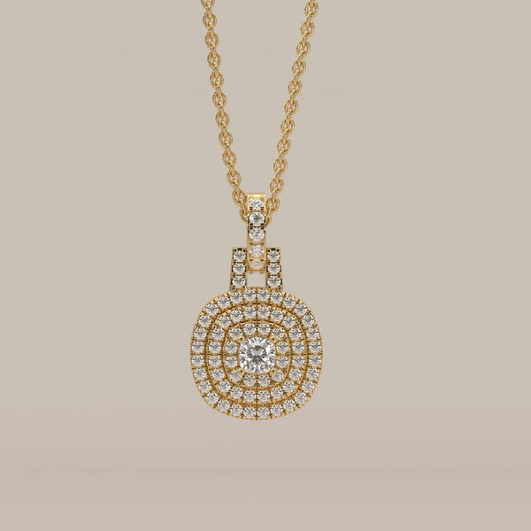 Gold pendant with double halo of diamonds surrounding a central diamond.