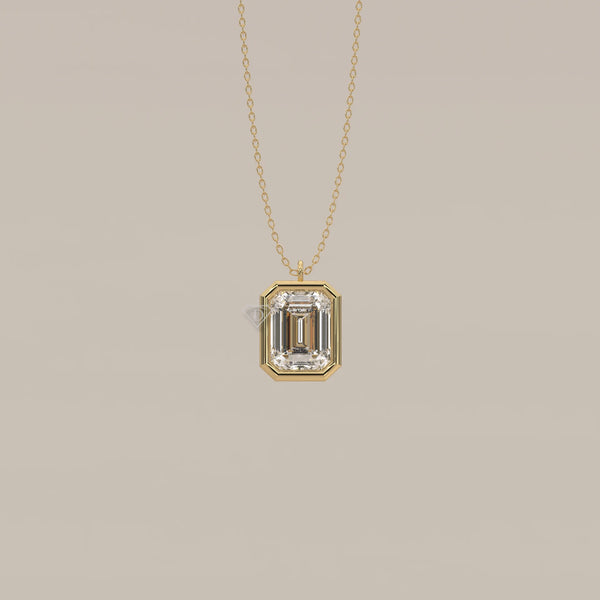 A gold necklace featuring a large emerald-cut diamond pendant.