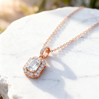 Close-up: Emerald Cut Diamond Pendant with Halo Setting in 14k Rose Gold - Lab Grown - Driona Jewels