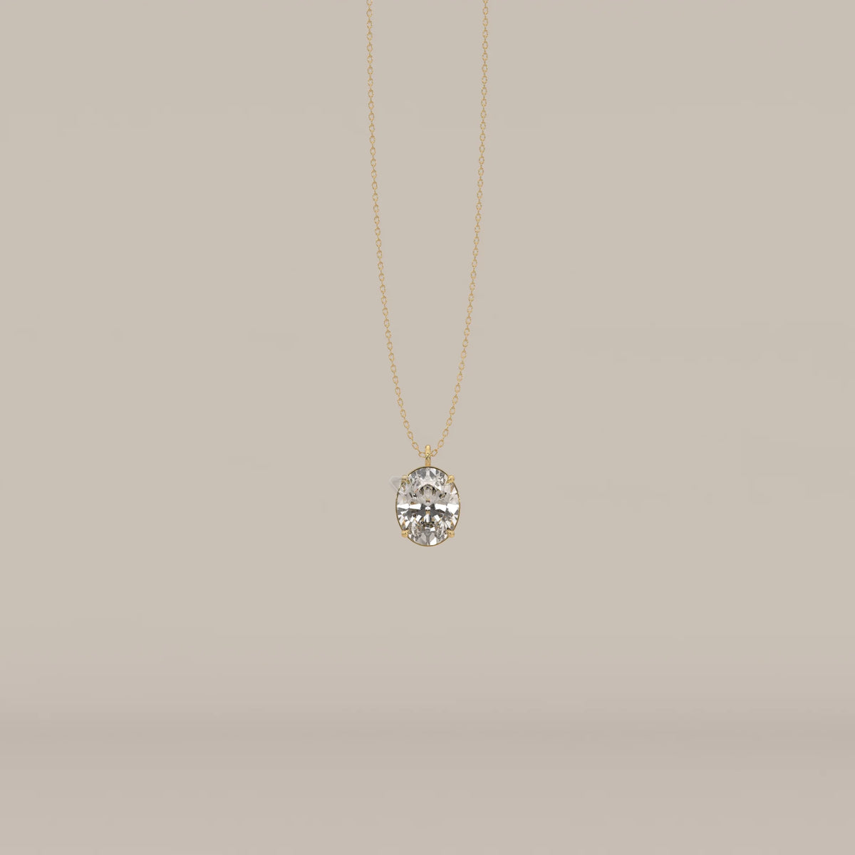 A gold necklace with a large, oval-cut diamond pendant.
