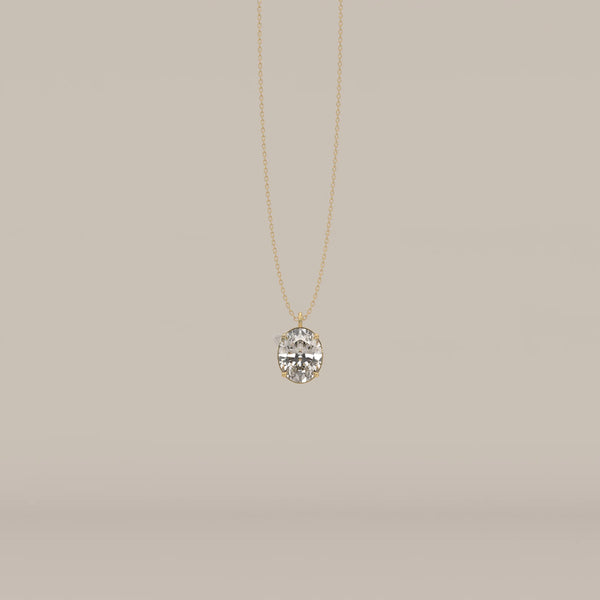 A gold necklace with a large, oval-cut diamond pendant.