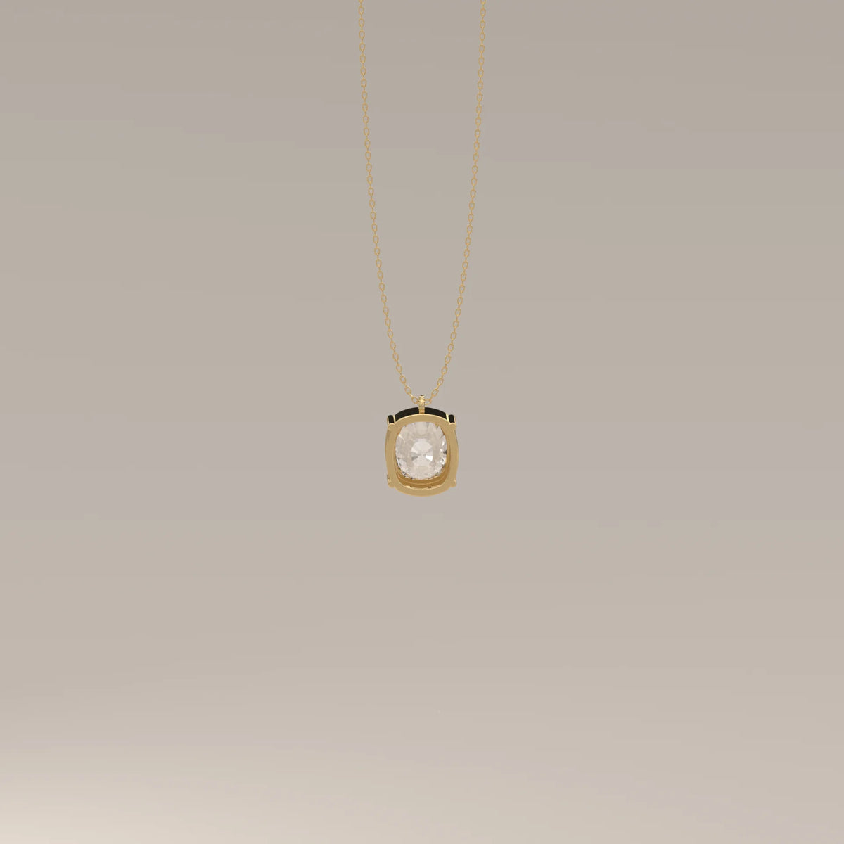 Gold pendant with a large oval faceted clear gemstone