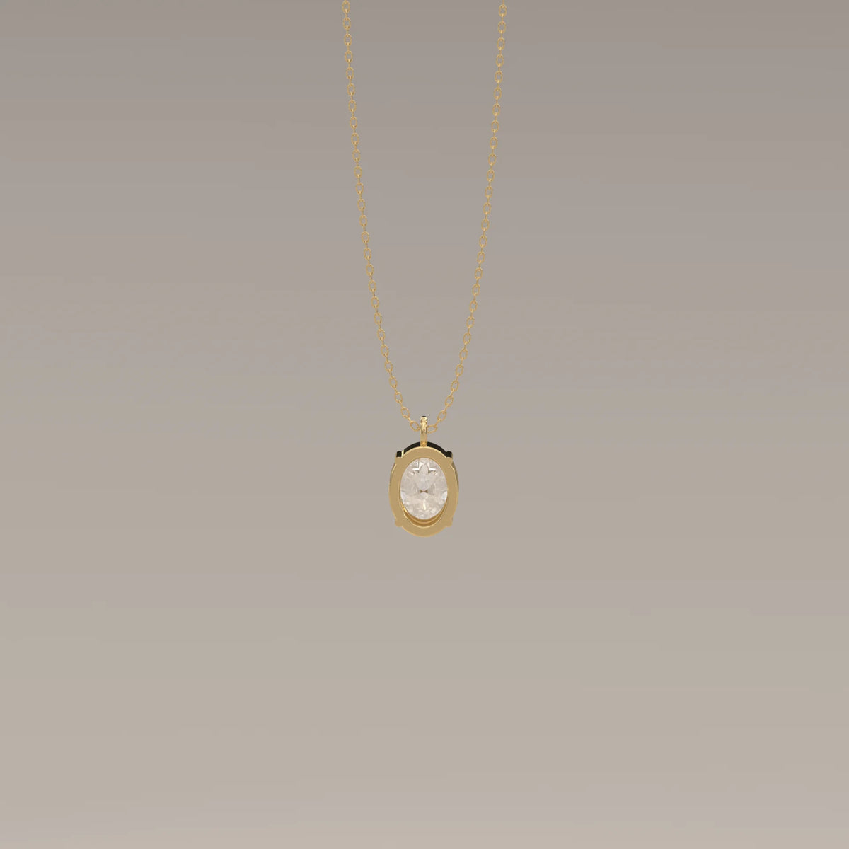 Gold pendant with an oval faceted stone.
