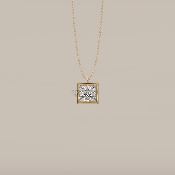 A princess-cut diamond pendant on a yellow gold chain