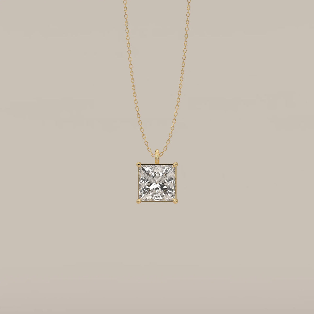 A classic 14k yellow gold pendant with a princess-cut diamond.