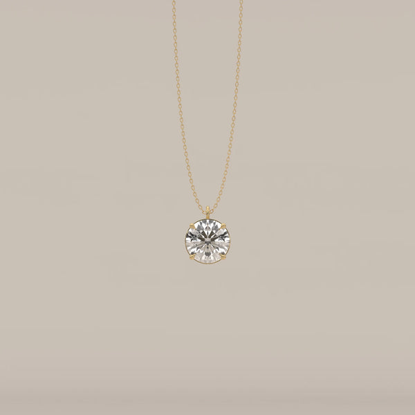 A 14k gold chain necklace with a large round brilliant cut diamond pendant.
