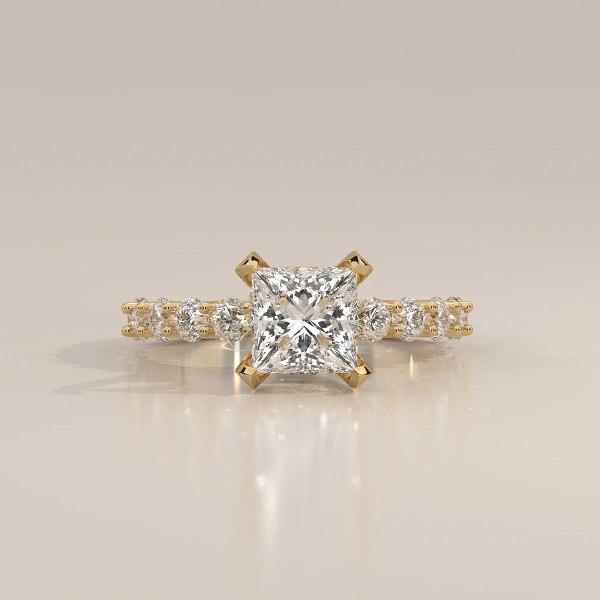 Princess Lab Grown Diamond Ring with Shared Claw Round Band in yellow gold, shown from the front.